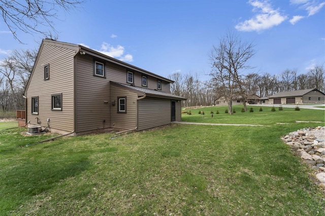 W7181 Duck Creek Ave, Westfield, WI 53964 - view of property exterior with a lawn and central AC unit