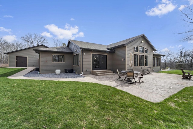 W7181 Duck Creek Ave, Westfield, WI 53964 - rear view of house with a lawn, a shingled roof, and a patio area
