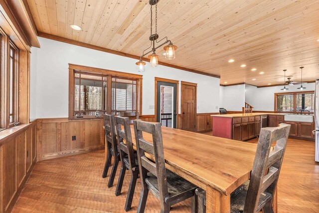 3853 County Rd E, Junction City, WI 54443 - dining area with a wainscoted wall, wood ceiling, light wood-style flooring, recessed lighting, and bar