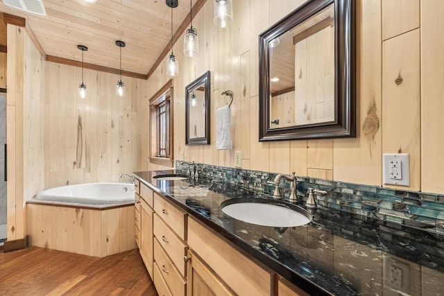 3853 County Rd E, Junction City, WI 54443 - bathroom featuring wood finished floors, wooden ceiling, wooden walls, a bath, and double vanity