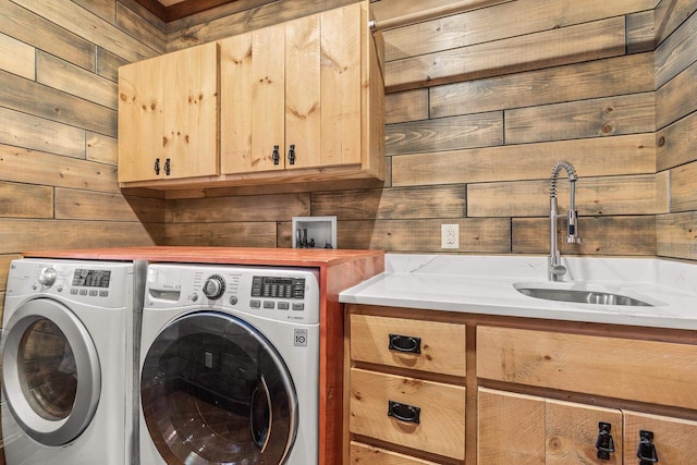 3853 County Rd E, Junction City, WI 54443 - laundry room featuring cabinet space, separate washer and dryer, and wood walls