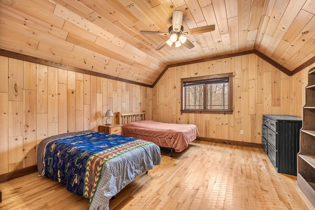 3853 County Rd E, Junction City, WI 54443 - bedroom featuring wooden ceiling, vaulted ceiling, light wood-style floors, wood walls, and ceiling fan