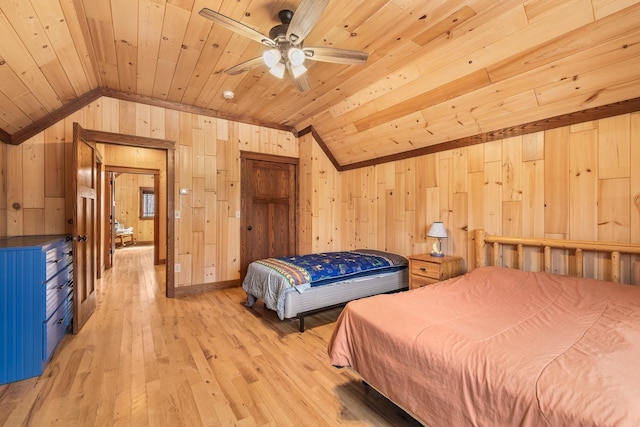 3853 County Rd E, Junction City, WI 54443 - bedroom with vaulted ceiling, wood ceiling, wooden walls, and light wood-style flooring