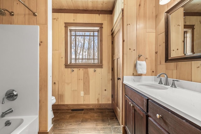 3853 County Rd E, Junction City, WI 54443 - full bathroom with wood walls, wood ceiling, shower / tub combination, vanity, and wood finished floors
