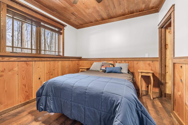 3853 County Rd E, Junction City, WI 54443 - bedroom featuring crown molding, wainscoting, wood finished floors, and wood ceiling