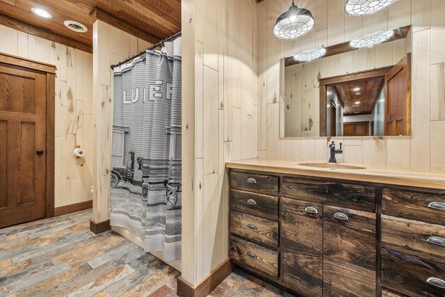 3853 County Rd E, Junction City, WI 54443 - full bath featuring vanity and wood walls