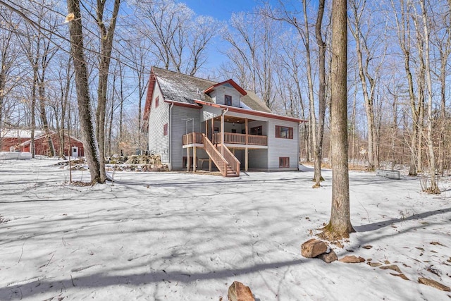 3853 County Rd E, Junction City, WI 54443 - snow covered back of property with stairs and a deck