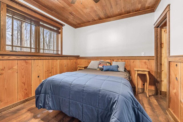 3853 County Rd E, Junction City, WI 54443 - bedroom featuring crown molding, wainscoting, wood finished floors, and wood ceiling