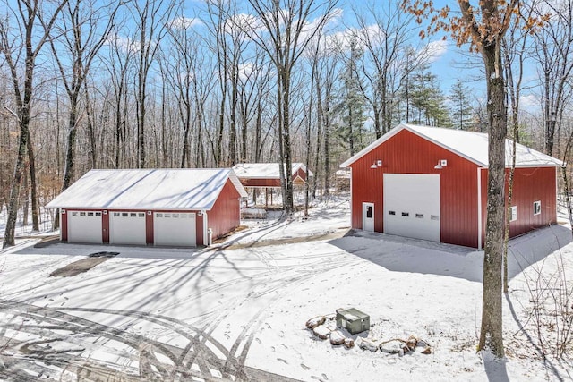 3853 County Rd E, Junction City, WI 54443 - snow covered garage with a detached garage