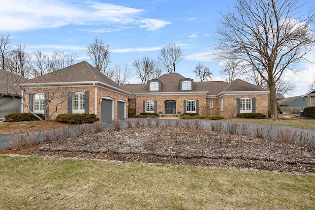 1012 E Kramer Ln, Appleton, WI 54915 - view of front of house with an attached garage and brick siding