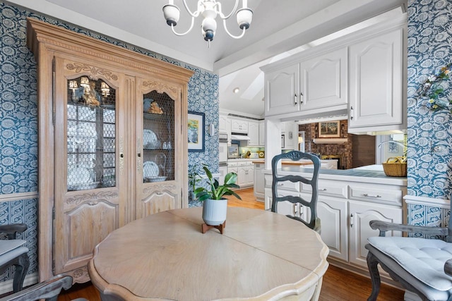 1012 E Kramer Ln, Appleton, WI 54915 - dining room with a chandelier, light wood finished floors, and wallpapered walls