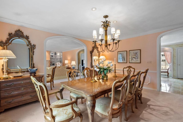 1012 E Kramer Ln, Appleton, WI 54915 - dining area with light carpet, arched walkways, a notable chandelier, and crown molding