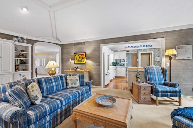 1012 E Kramer Ln, Appleton, WI 54915 - living area featuring visible vents, light carpet, vaulted ceiling with beams, wallpapered walls, and baseboards