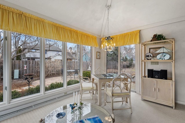 1012 E Kramer Ln, Appleton, WI 54915 - dining room featuring light carpet, vaulted ceiling, and a chandelier