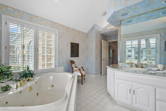 1012 E Kramer Ln, Appleton, WI 54915 - bathroom with vanity, a jetted tub, wallpapered walls, tile patterned floors, and lofted ceiling