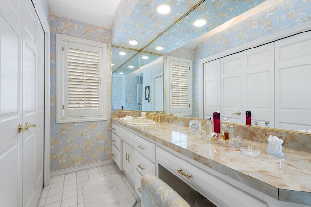 1012 E Kramer Ln, Appleton, WI 54915 - bathroom featuring a closet, baseboards, vanity, wallpapered walls, and tile patterned floors
