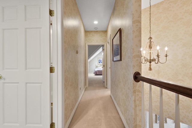 1012 E Kramer Ln, Appleton, WI 54915 - hall with light colored carpet, a chandelier, baseboards, and wallpapered walls
