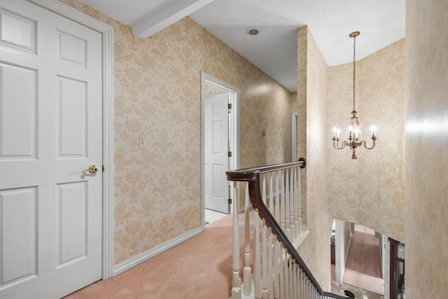 1012 E Kramer Ln, Appleton, WI 54915 - hall featuring baseboards, an inviting chandelier, wallpapered walls, an upstairs landing, and carpet floors
