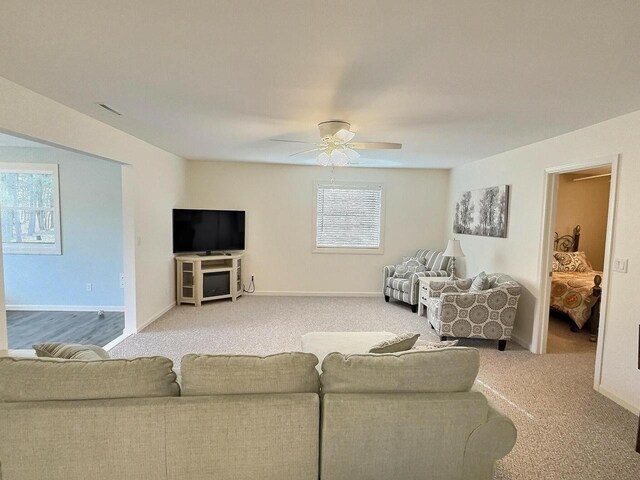 N9378 21st Ave, Neshkoro, WI 54960 - living room featuring visible vents, baseboards, a ceiling fan, and carpet floors