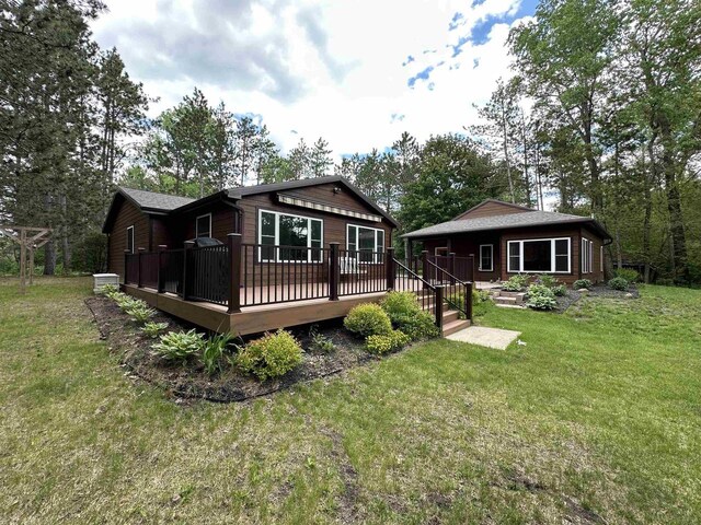 N9378 21st Ave, Neshkoro, WI 54960 - back of property featuring a yard and a deck