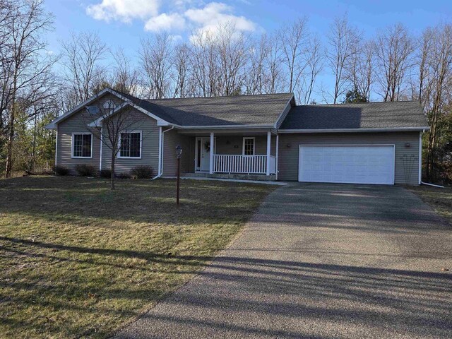 246 Golliher Ct, Westfield, WI 53964 - ranch-style home featuring a garage, a porch, driveway, and a front lawn