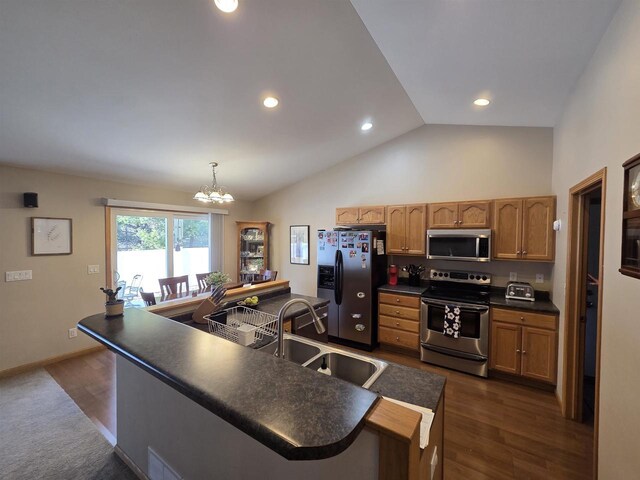246 Golliher Ct, Westfield, WI 53964 - kitchen featuring a notable chandelier, a sink, dark countertops, stainless steel appliances, and lofted ceiling