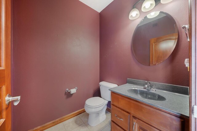 3895 Shorebird Ct, Oshkosh, WI 54904 - half bathroom featuring tile patterned floors, vanity, baseboards, and toilet