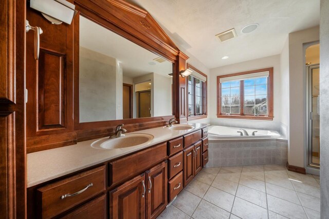 3895 Shorebird Ct, Oshkosh, WI 54904 - bathroom with a sink, a shower stall, tile patterned flooring, and a garden tub