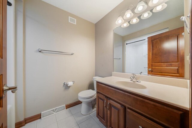 3895 Shorebird Ct, Oshkosh, WI 54904 - bathroom featuring vanity, baseboards, tile patterned floors, toilet, and visible vents