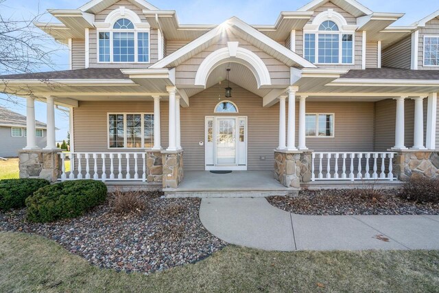 3895 Shorebird Ct, Oshkosh, WI 54904 - property entrance featuring a porch and roof with shingles