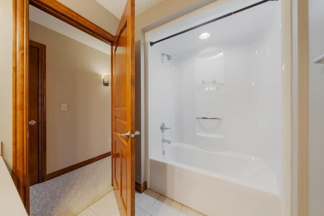 3895 Shorebird Ct, Oshkosh, WI 54904 - bathroom featuring tile patterned flooring, shower / tub combination, and baseboards