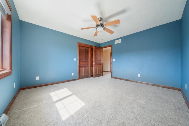 3895 Shorebird Ct, Oshkosh, WI 54904 - unfurnished bedroom featuring baseboards, visible vents, and carpet floors