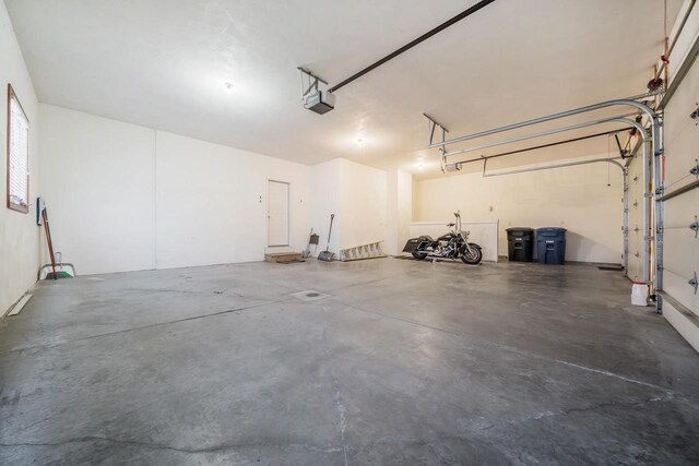 3895 Shorebird Ct, Oshkosh, WI 54904 - garage featuring a garage door opener