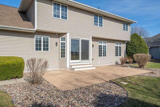 3895 Shorebird Ct, Oshkosh, WI 54904 - back of property with a patio area, entry steps, and a shingled roof