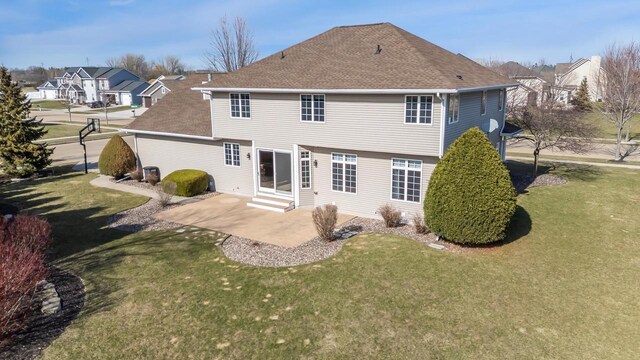 3895 Shorebird Ct, Oshkosh, WI 54904 - back of house with a patio, entry steps, a yard, and a shingled roof