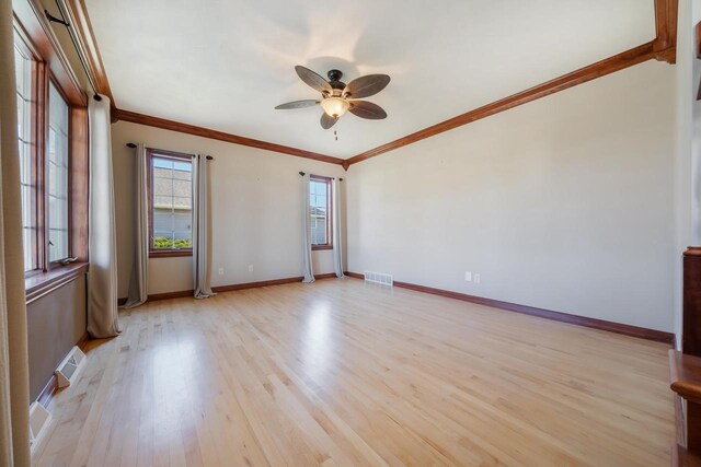 3895 Shorebird Ct, Oshkosh, WI 54904 - empty room with light wood-style floors, baseboards, a ceiling fan, and visible vents