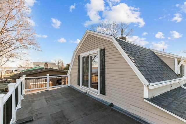 2963 Sunset Point Ln, Oshkosh, WI 54904 - exterior space with roof with shingles, a gambrel roof, and a patio area