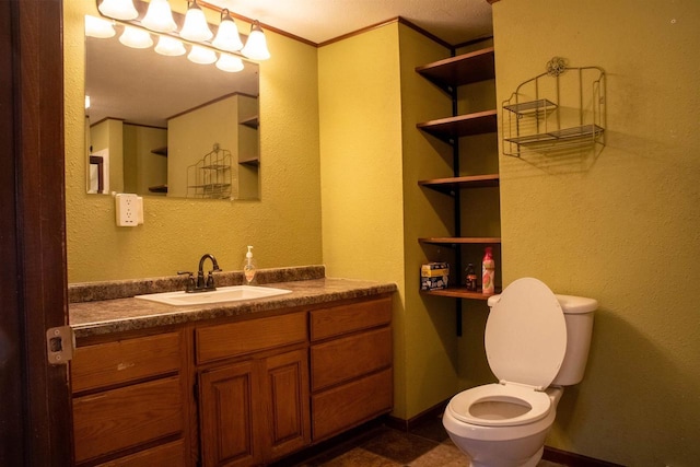 2940 Plover Springs Dr, Plover, WI 54467 - bathroom with baseboards, ornamental molding, toilet, a textured wall, and vanity