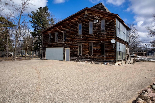 2940 Plover Springs Dr, Plover, WI 54467 - view of home's exterior featuring fence, a garage, and aphalt driveway