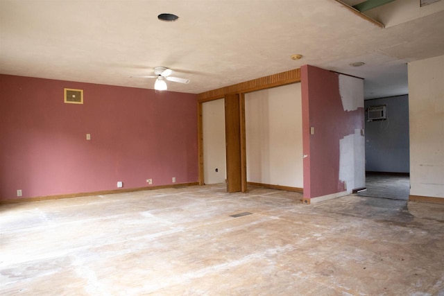 2940 Plover Springs Dr, Plover, WI 54467 - unfurnished room featuring a wall mounted air conditioner, visible vents, baseboards, and a ceiling fan