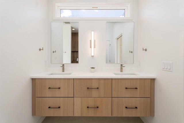 full bath featuring double vanity and a sink