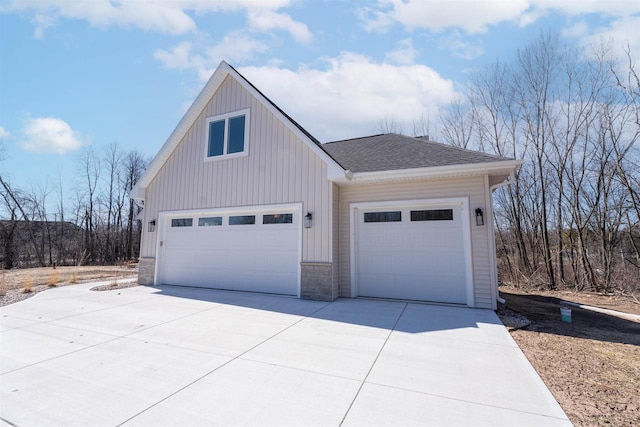 garage with concrete driveway