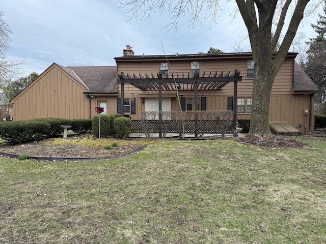 rear view of property featuring a pergola, a yard, roof with shingles, and a chimney