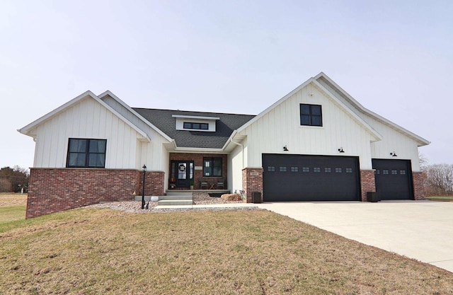 1817 Arboretum Dr, Janesville, WI 53548 - modern farmhouse style home featuring brick siding, a front yard, and concrete driveway