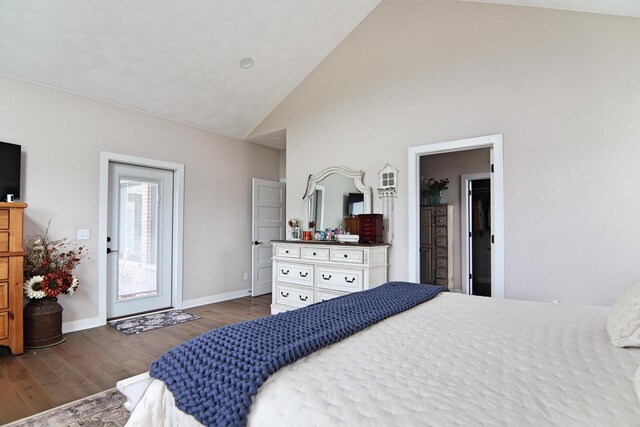 1817 Arboretum Dr, Janesville, WI 53548 - bedroom with high vaulted ceiling, baseboards, and wood finished floors