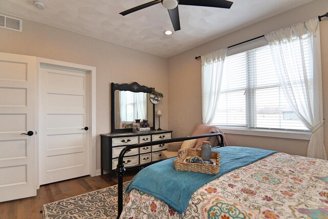 1817 Arboretum Dr, Janesville, WI 53548 - bedroom featuring dark wood-type flooring, ceiling fan, and visible vents