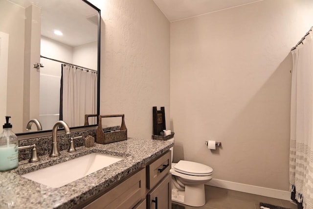 1817 Arboretum Dr, Janesville, WI 53548 - full bath with curtained shower, vanity, baseboards, and toilet
