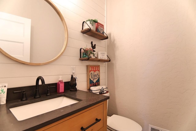 1817 Arboretum Dr, Janesville, WI 53548 - half bath with toilet, vanity, and a textured wall