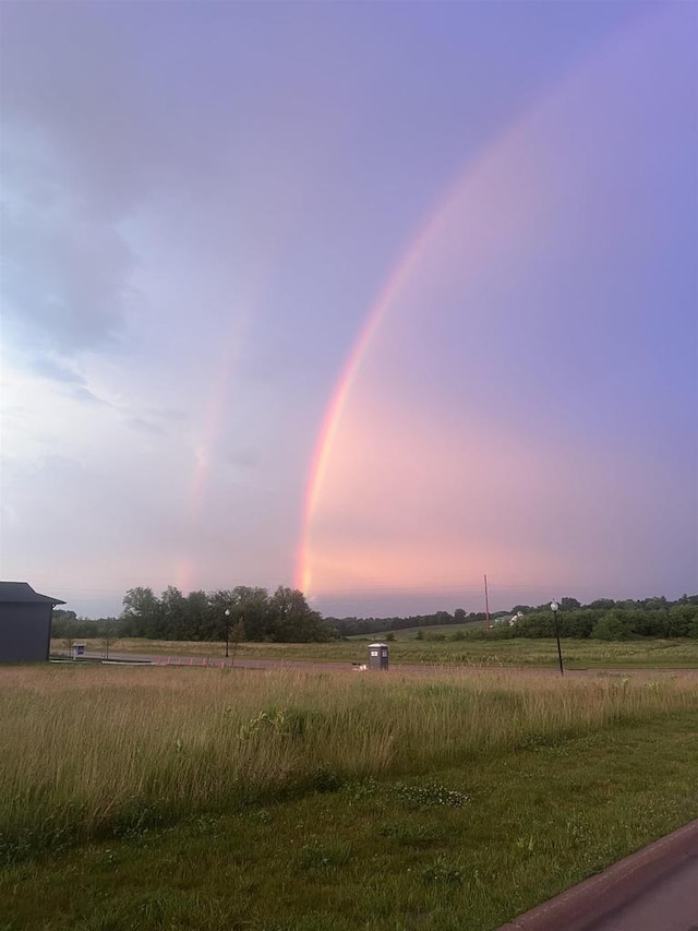 1817 Arboretum Dr, Janesville, WI 53548 - yard at dusk featuring a rural view