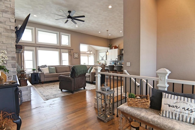 1817 Arboretum Dr, Janesville, WI 53548 - living room with recessed lighting, a towering ceiling, a ceiling fan, and hardwood / wood-style flooring